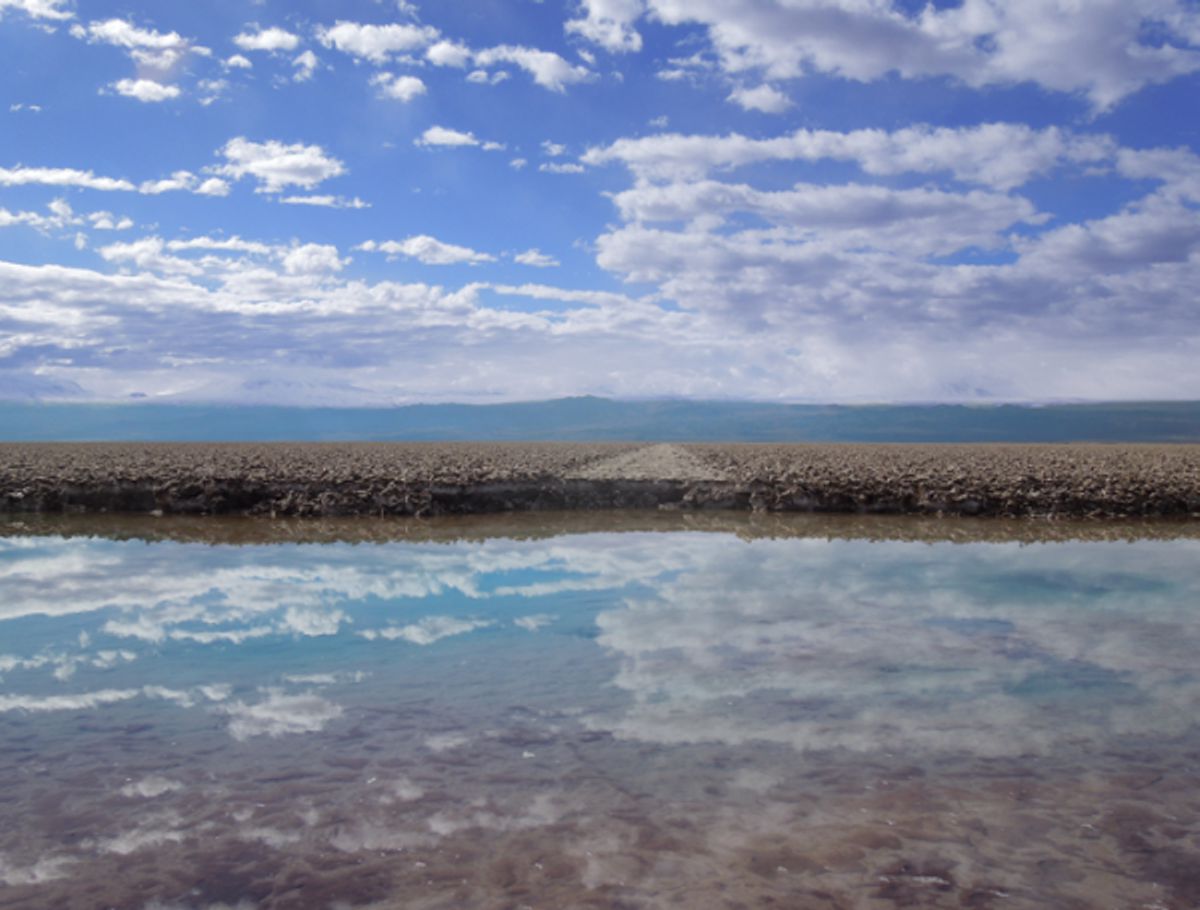 Credit: UMass Amherst An abandoned road and brine Transitional Pool at the margin of the Salar de Atacama Halite Nucleus